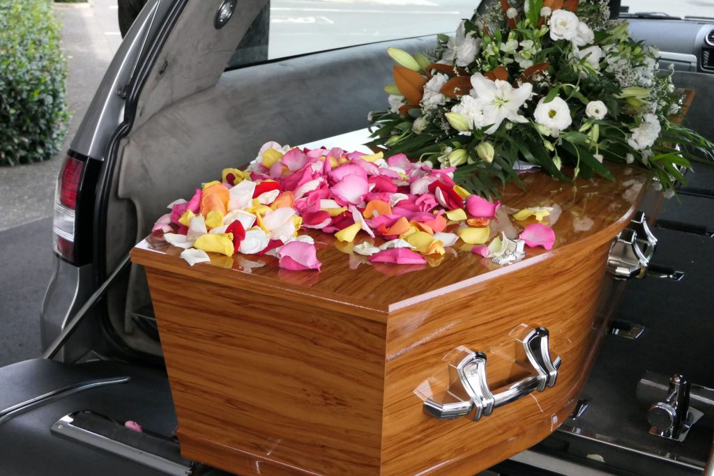 casket in a christian hearse