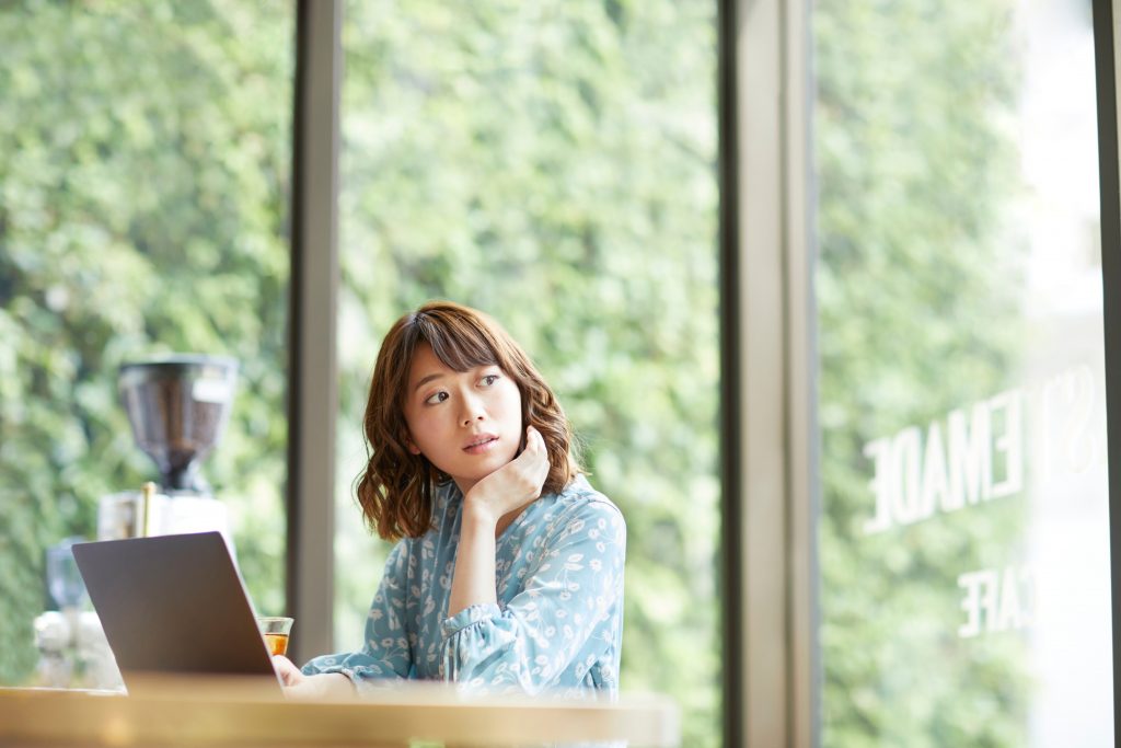 woman thinking of which casket to choose in Singapore